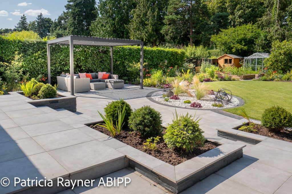 Another view of the beautiful garden showing the patio.