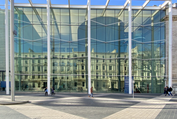 Imperial College Lovely bright glass front elevation with students walking.