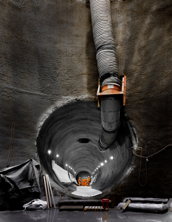 Construction Tunnels imagery deep down 60m below the River Thames with engineers near end showing the size of the amazing tunnels