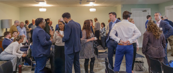 people socialise and network during an indoor London Conference event.